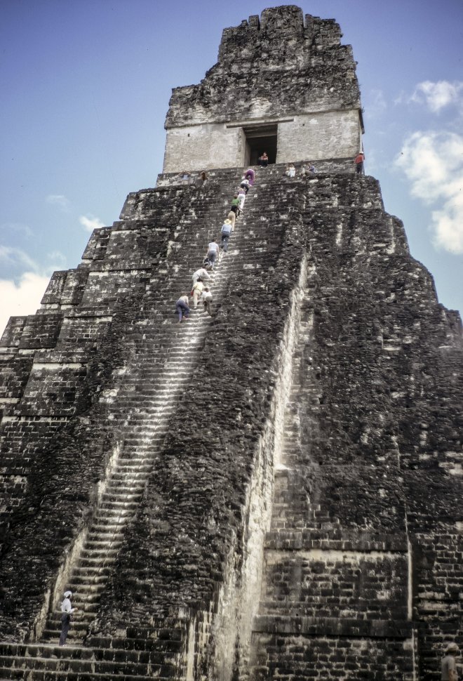 Free image of Group of tourists climbing the steep stairway of the Mayan temple Tikal, Guatemala