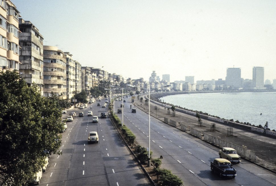 Free image of Traffic travelling along a seawall, India