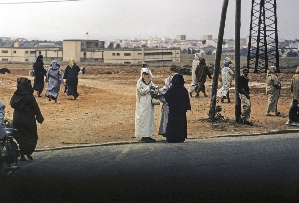 Free image of Missionary standing on the street with locals, circa 1971, Morocco, Africa