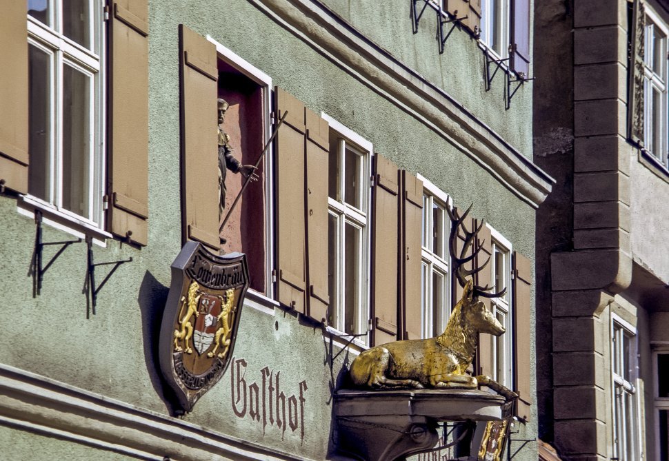 Free image of Front of a building with a statue of a deer and a man, Europe