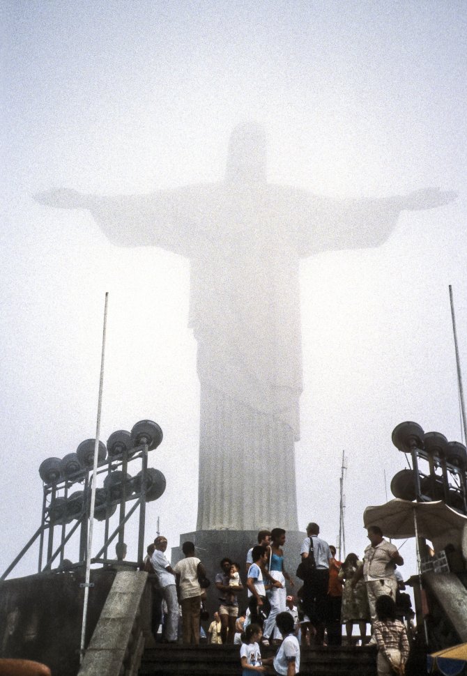 Free image of Group of people standing below the statue  Christ the Redeemer  in Rio de Janeiro, Brazil