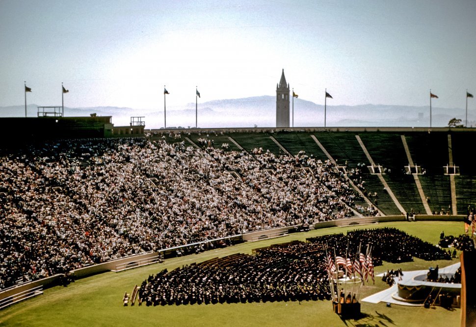 Free image of College graduation crowd and students at commencement on a field, USA
