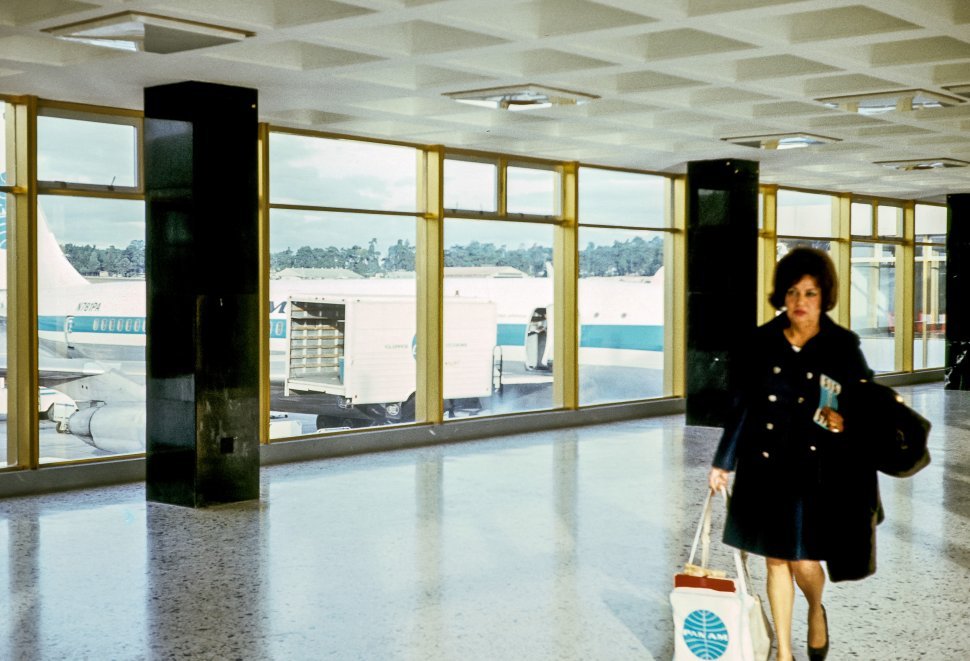 Free image of Woman walking through an airport.