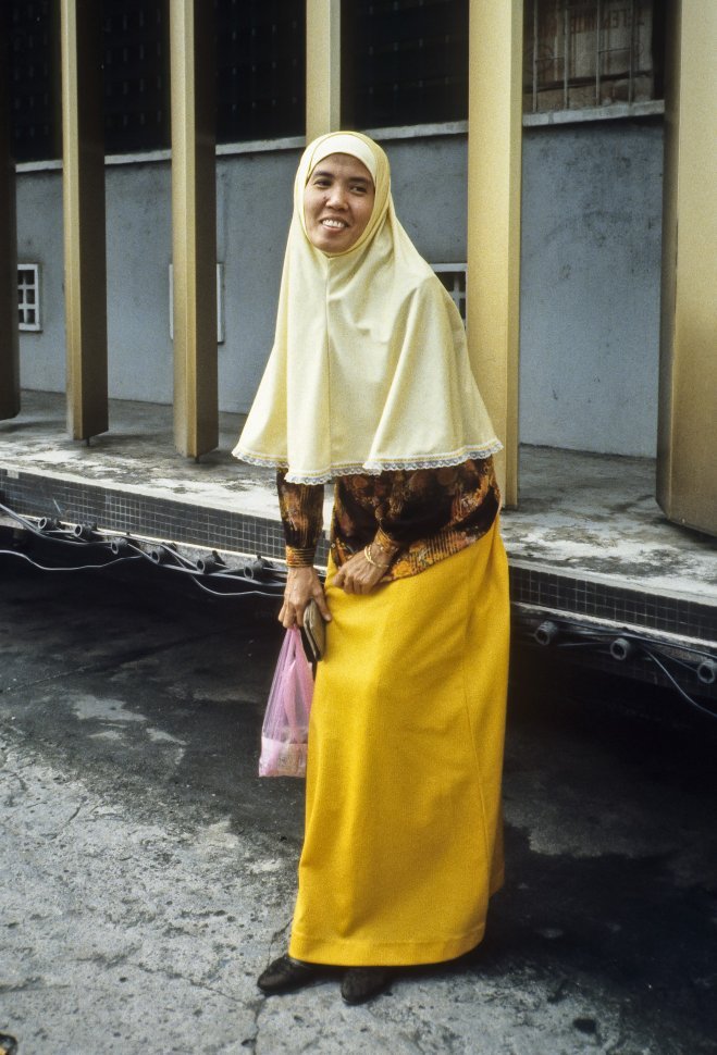 Free image of Woman posing and laughing for the camera, Asia