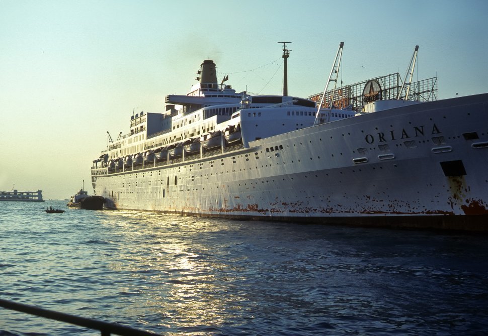 Free image of Large cruise ship docked at port.