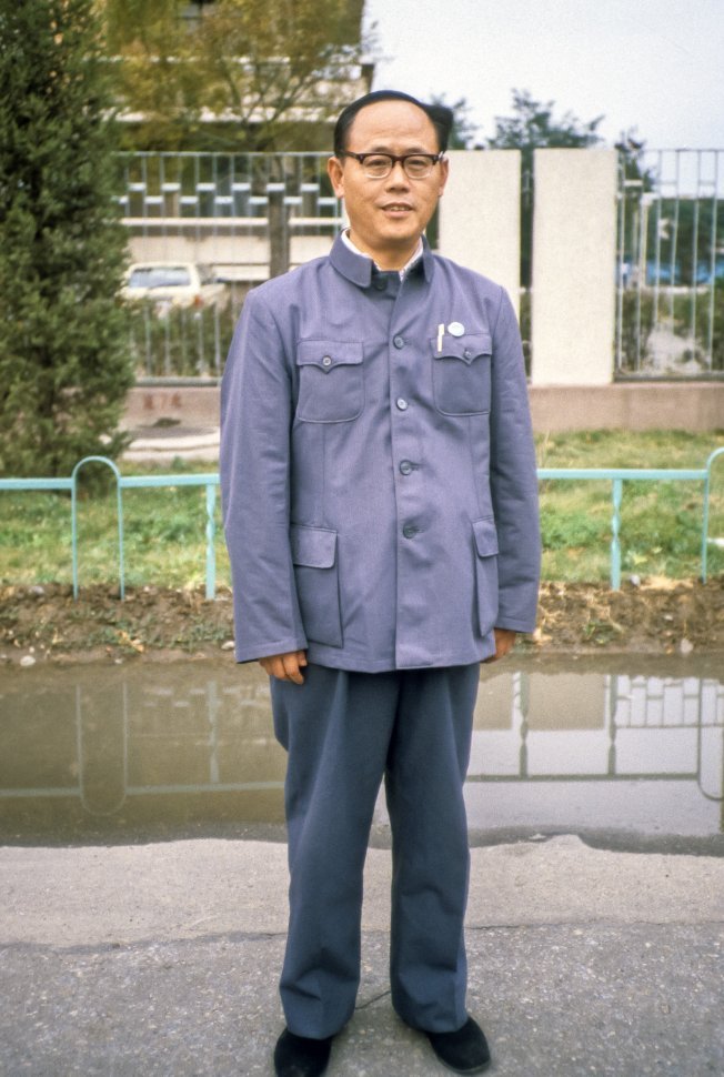 Free image of Portrait of a Chinese man standing on the street, China