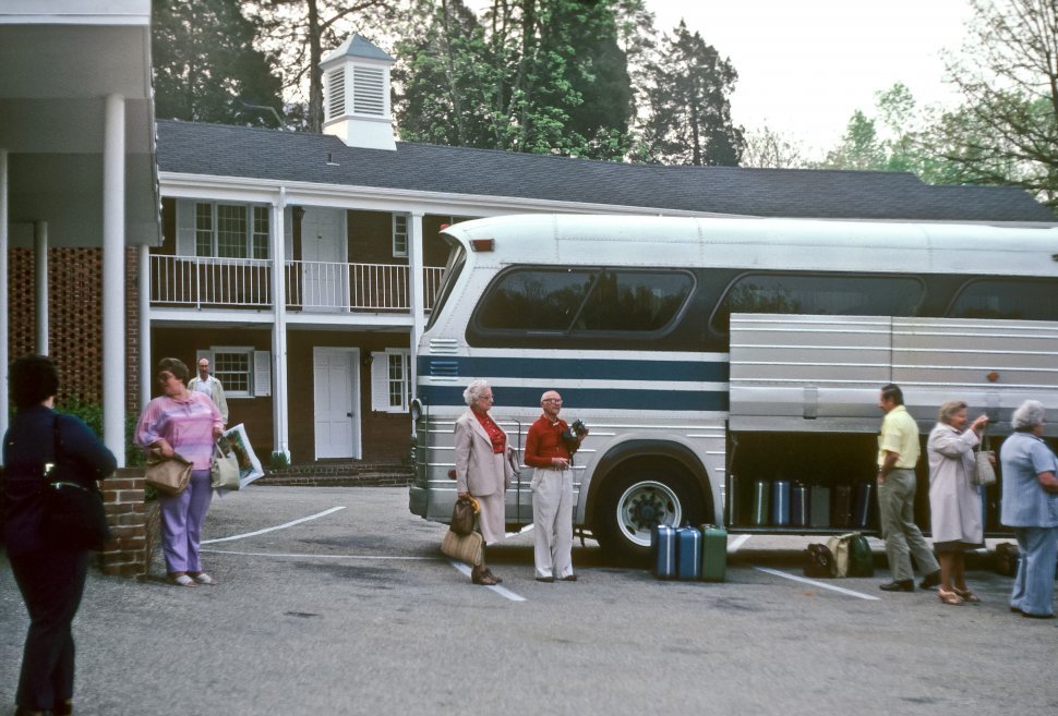 Free image of Tourists boarding a tour bus, USA
