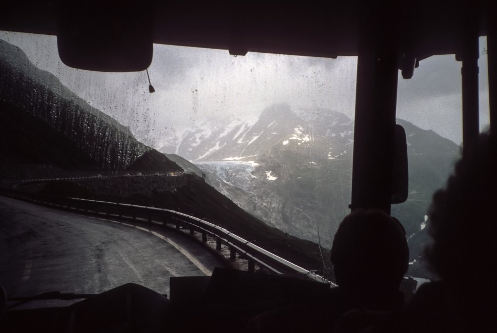 Free image of View through the bus window of a mountain storm forming above a mountain valley, Europe