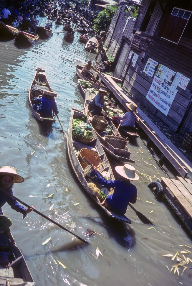 Free image of Vendors on a the water in a floating market, China