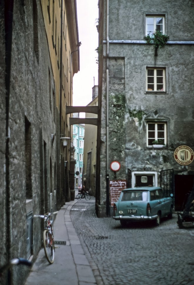 Free image of Small alley with a car and bicycle parked, Innsbruck, Austria, Europe