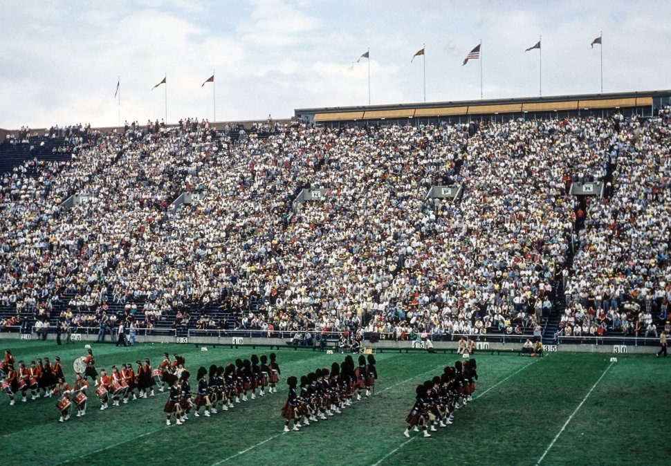 Free image of View of a crowded stadium with marching band performing, USA