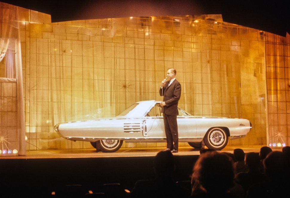Free image of Man announcing a car at an auto show, USA