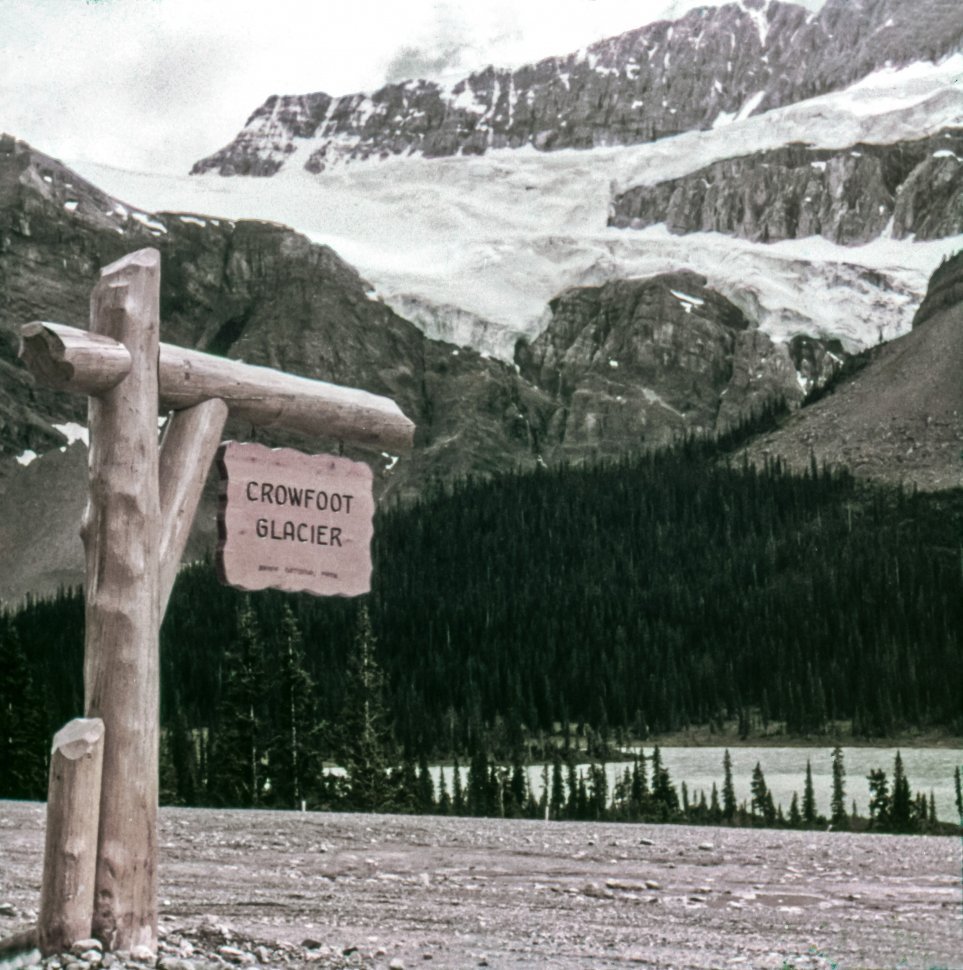 Free image of Sign below a mountain and Crowfoot Glacier, Banff National Park, Canada