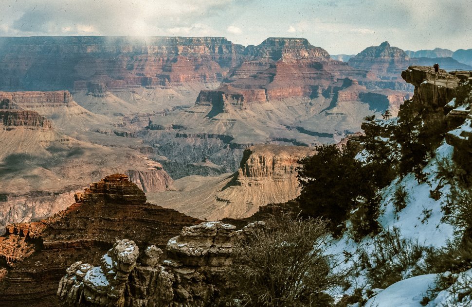 Free image of View of Grand Canyon with snow capped mountain in the foreground