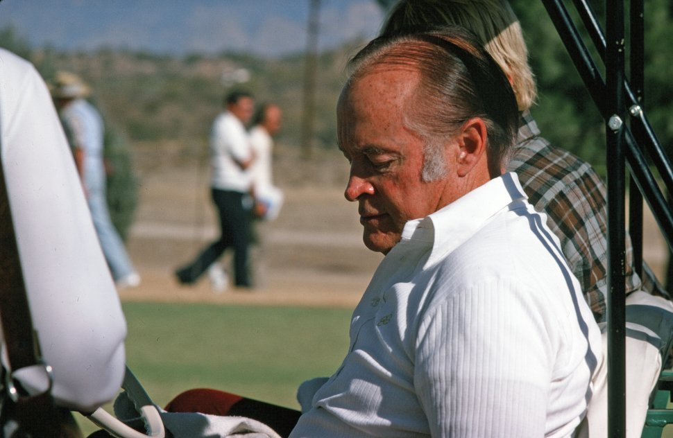 Free image of Bob Hope sitting in a golf cart